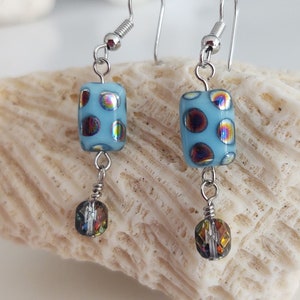 A beautiful turquoise color Chech glass bead dangle earring.