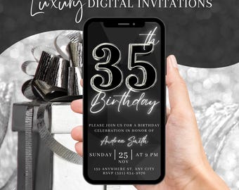 May include: A black and silver digital invitation for a 35th birthday party. The invitation features a large, silver 35 with a black background. The text "35th Birthday" is written in a white, cursive font. The invitation also includes the name "Andrea Smith", the date "Sunday, 25th November", the time "9 PM", the address "132 Anywhere St., Any City", and the RSVP number "(321) 654-9576".