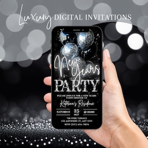 May include: A smartphone displays a digital New Year's Party invitation. The black screen features silver and black balloons, with the words "New Years Party" in elegant script. The invitation includes event details.