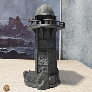 May include: A gray stone tower with a domed roof and a balcony. The tower is surrounded by rocks and is on a gray surface.