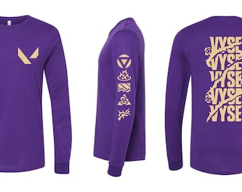 May include: Purple long-sleeve t-shirt with a gold Valorant logo on the front and a gold "VYSE" graphic on the back.