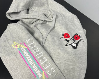 May include: Gray hooded sweatshirt with a cartoon character with red eyes and a knife on the front. The left sleeve has the text "MEGA PIZZAPLEX" and "SECURITY" in a retro style font.