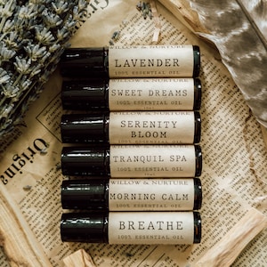May include: A set of eight 10ml essential oil roller bottles with black caps and white labels. The labels have the brand name "Willow & Nurture" and the names of the essential oils: Lavender, Sweet Dreams, Serenity Bloom, Tranquil Spa, Morning Calm, Breathe.