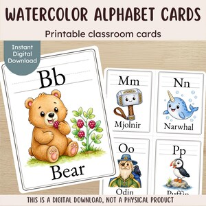 May include: Watercolor alphabet cards featuring illustrations of a bear, Mjolnir, a narwhal, Odin, and a puffin. Each card displays uppercase and lowercase letters with corresponding text labels. The cards are labeled "WATERCOLOR ALPHABET CARDS" and "Printable classroom cards" with a note stating "THIS IS A DIGITAL DOWNLOAD, NOT A PHYSICAL PRODUCT."