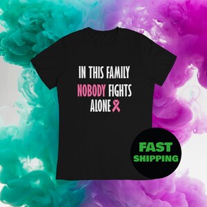 In This Family Nobody Fights Alone Shirt, Cancer Support Shirt, Pink Ribbon, Breast Cancer Shirt, Cancer Warrior Shirt, Cancer Awareness.