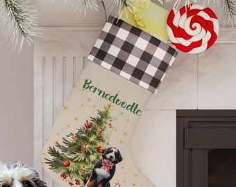 May include: A Christmas stocking with a black and white checkered cuff, a red and white candy cane, and a Bernedoodle dog in front of a Christmas tree. The stocking is personalized with the name "Bernedoodle".