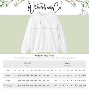 May include: A white Gildan 18000 sweatshirt with a crew neck. The image includes a size chart with measurements in inches and centimetres. The text "Winterbrook Co" is at the top of the image.