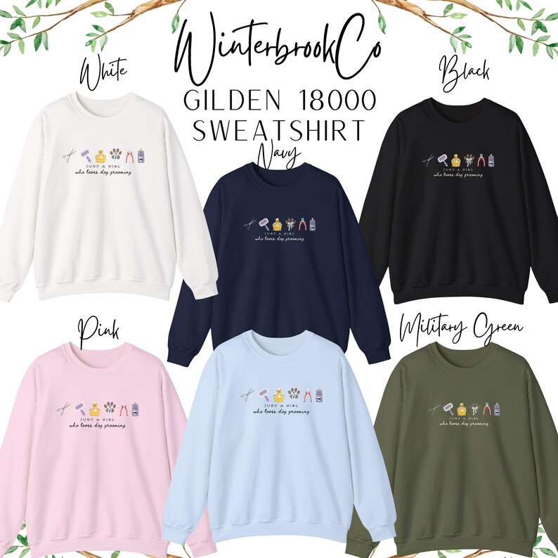 May include: A selection of Gildan 18000 sweatshirts in white, navy, black, pink, light blue, and military green. Each sweatshirt displays a small graphic and the text "JUST A GIRL who loves dog grooming."