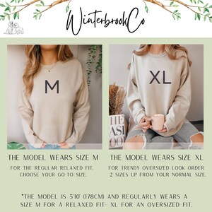 May include: Two images side-by-side showcasing beige sweatshirts. The left image displays a sweatshirt with an "M" printed on it, while the right image shows an "XL" sweatshirt. Text below the images provides sizing information and model measurements of 178cm.