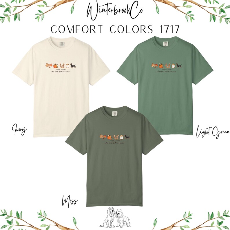 May include: Three Comfort Colors t-shirts in ivory, light green, and moss green. Each shirt features a small graphic of fall-themed objects and a dachshund. The text "just a girl who loves fall & wiener" is below the graphic.