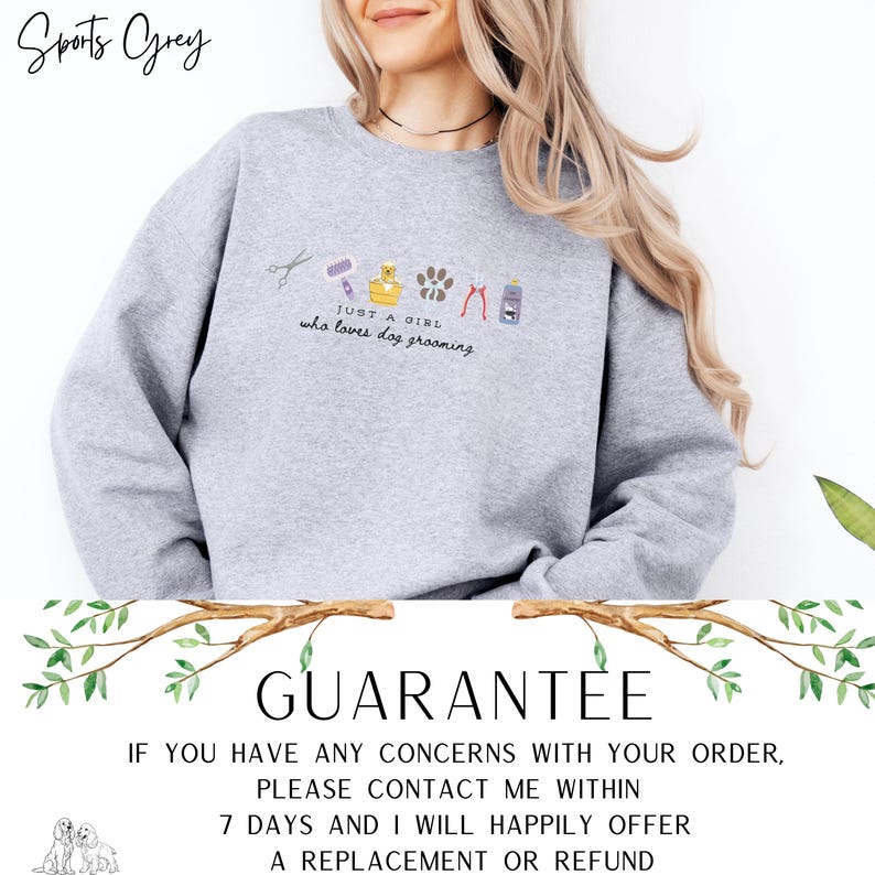 May include: A light grey sweatshirt featuring the embroidered text "JUST A GIRL who loves dog grooming" and dog grooming tools. The garment has a crew neck and long sleeves. The word "GUARANTEE" is printed below the sweatshirt.