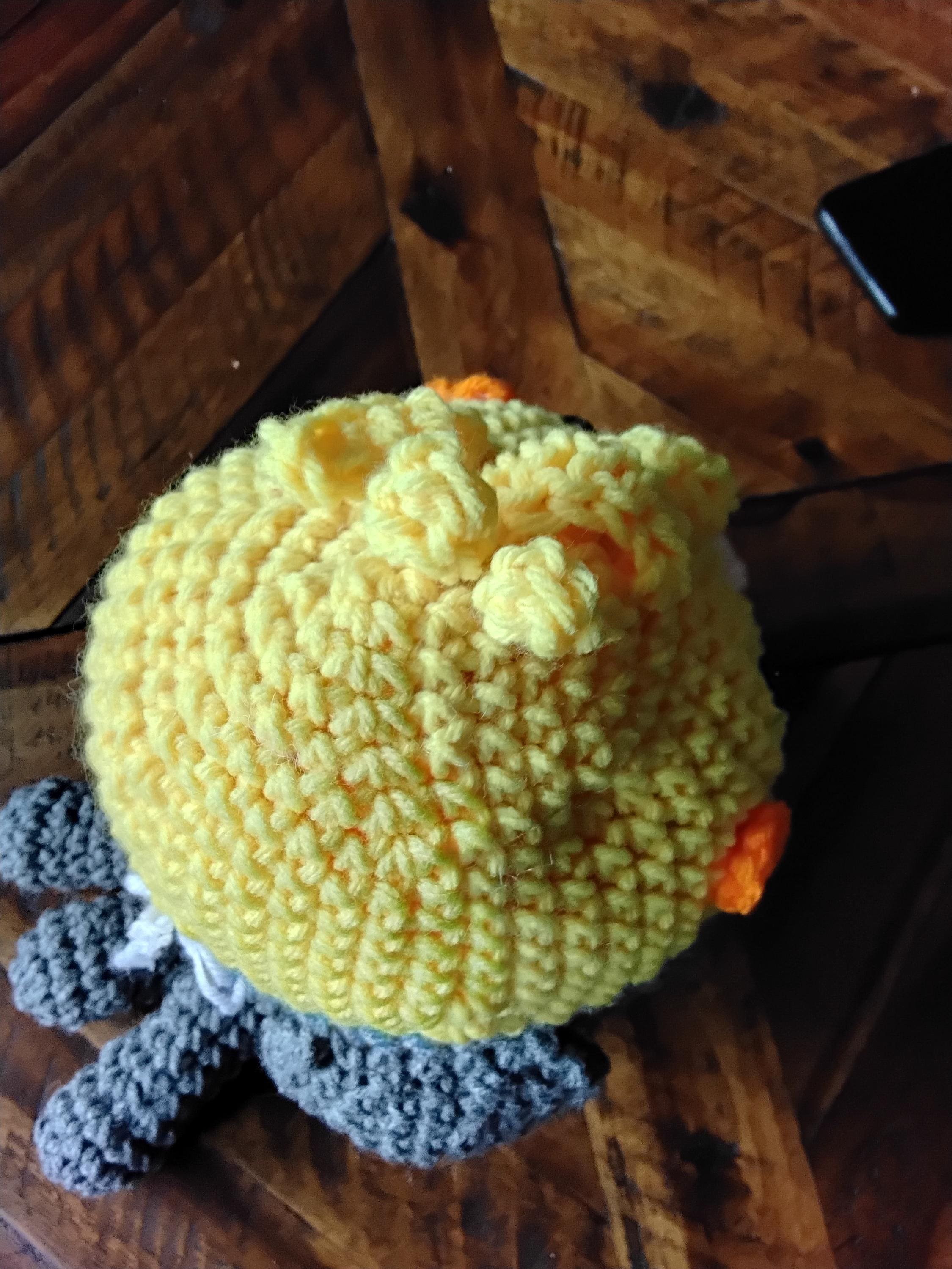 Grey & yellow cockatiel . My cockatiel is quite fluffy and crocheted by Ruth following pattern by Lauren Espy from her book Animal Amigurumi