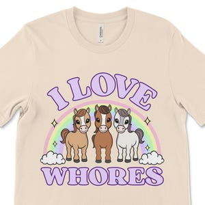 Funny offensive t shirt with the phrase “I Love Whores” and cartoon horses, dirty raunchy design perfect for inappropriate tshirt exchange party or adult humor fans.