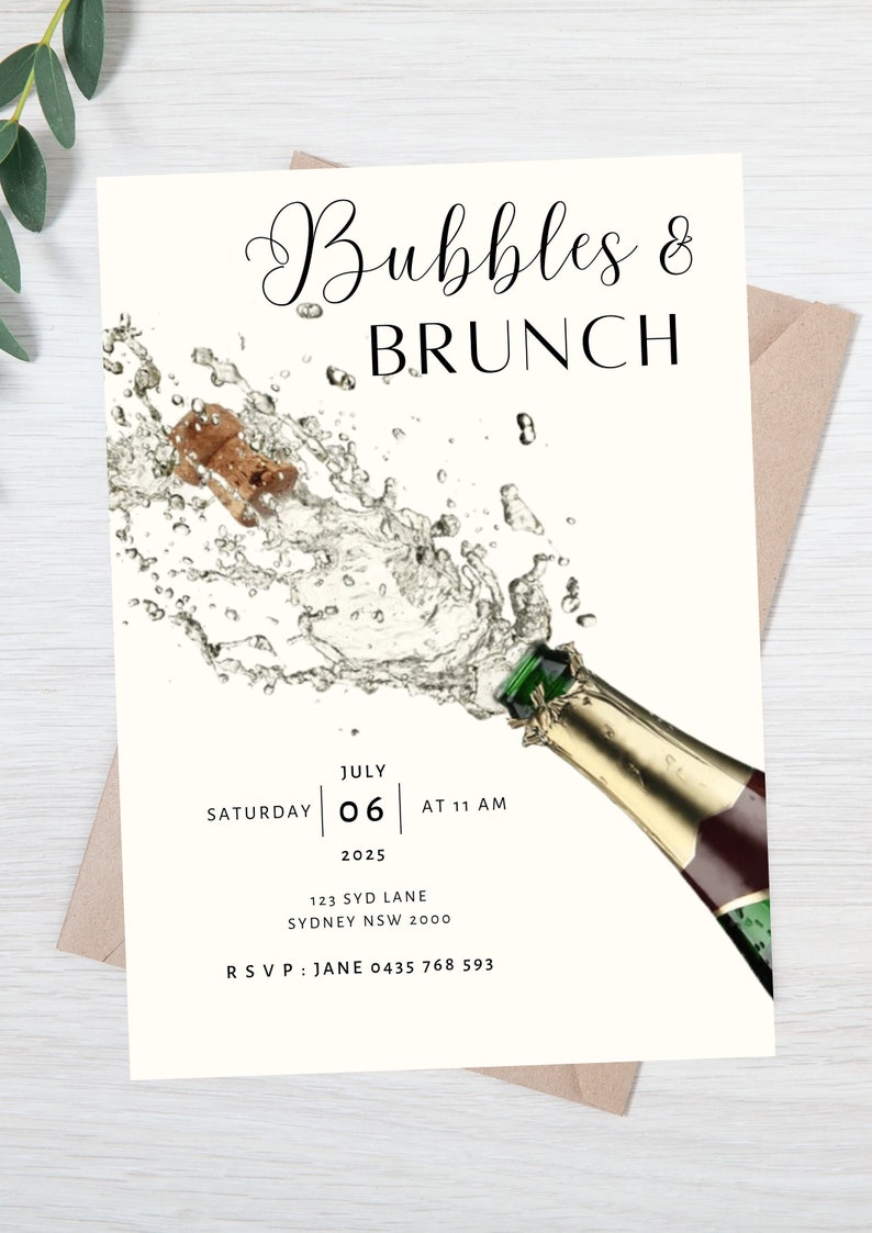 May include: A white invitation card with a champagne bottle popping with bubbles. The text on the card reads "Bubbles & Brunch", "Saturday July 06 at 11 AM 2025", "123 Syd Lane Sydney NSW 2000", and "RSVP: Jane 0435 768 593".