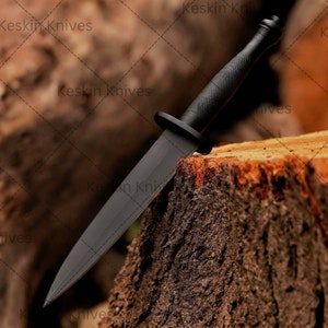 Fairbairn Sykes-style commando knife replica with black grip handle