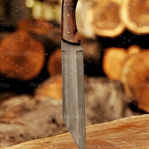 May include: A large, fixed blade knife with a dark wood handle. The blade is made of steel and has a sharp point. The knife is resting on a wooden surface.