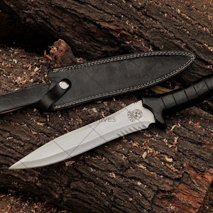 Close-up of custom D2 steel blade with sharp spear-point edge