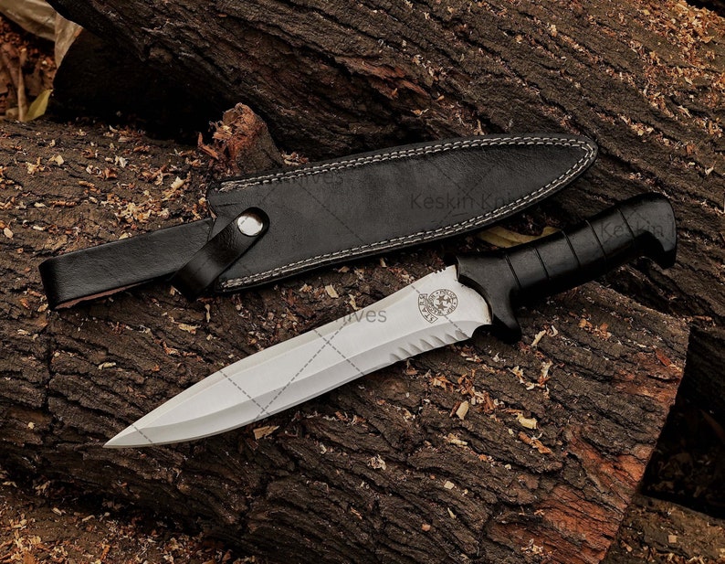 Close-up of custom D2 steel blade with sharp spear-point edge