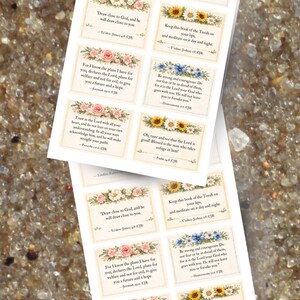 May include: A collection of rectangular stickers with floral borders and inspirational quotes. The stickers feature various flower designs, including roses and sunflowers, and are printed with text from religious scriptures.
