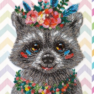May include: A beaded portrait of a raccoon, adorned with a floral crown and necklace. The raccoon is rendered in grey and black beads, with large eyes and colourful accents. The background has a chevron pattern.