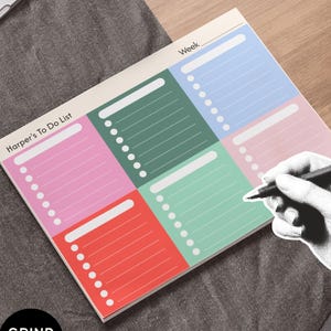 May include: A rectangular weekly planner notepad featuring six colorful sections in pink, dark green, light blue, light green, and red. Each section includes a header space and a list of bullet points. The text "Harper's To Do List" and "Week" are printed on the top.