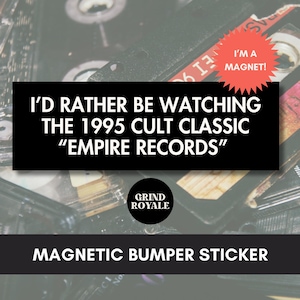 May include: Black magnetic bumper sticker with the text "I'D RATHER BE WATCHING THE 1995 CULT CLASSIC 'EMPIRE RECORDS'". A red starburst sticker reads "I'M A MAGNET!". The Grind Royale logo is in a black circle.