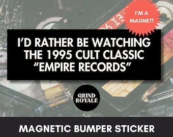 May include: Black magnetic bumper sticker with the text "I'D RATHER BE WATCHING THE 1995 CULT CLASSIC 'EMPIRE RECORDS'". A red starburst sticker reads "I'M A MAGNET!". The Grind Royale logo is in a black circle.
