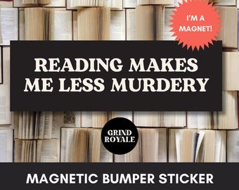 May include: A rectangular magnetic bumper sticker with a black background and white text that reads READING MAKES ME LESS MURDERY. A coral-colored starburst graphic in the top right corner says I'M A MAGNET. A black circle logo reads GRIND ROYALE.