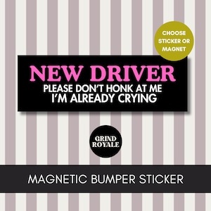 May include: A black magnetic bumper sticker with the text "NEW DRIVER PLEASE DON'T HONK AT ME I'M ALREADY CRYING" in pink and white. The sticker also includes the Grind Royale logo and the words "CHOOSE STICKER OR MAGNET".