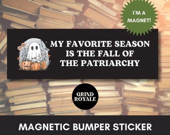 May include: Black magnetic bumper sticker with the text "MY FAVORITE SEASON IS THE FALL OF THE PATRIARCHY". The sticker features a cartoon ghost, pumpkins, and the words "I'M A MAGNET!" in a green starburst.