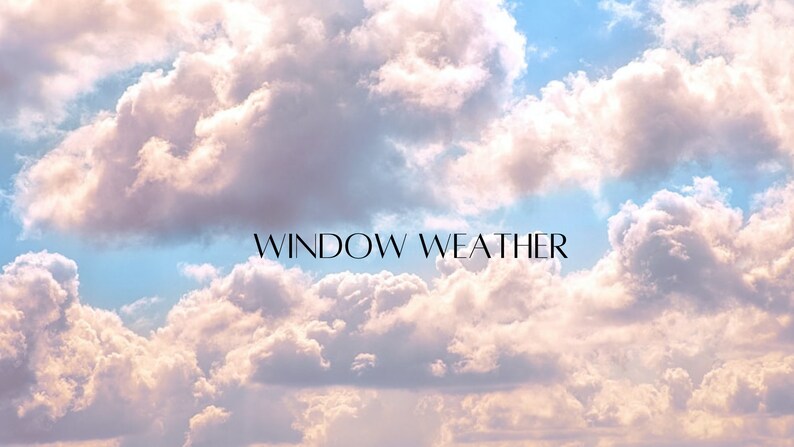 May include: A photograph of a bright blue sky with fluffy white clouds. The text "WINDOW WEATHER" is written in black letters across the middle of the image.