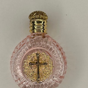 The Holy Water Bottle- pink glass-brass emblem of the Holy Cross