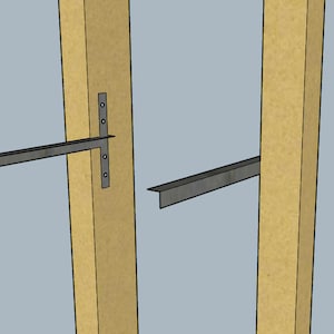 May include: Two metal brackets are attached to two wooden beams. The brackets are used to support a shelf or other structure.