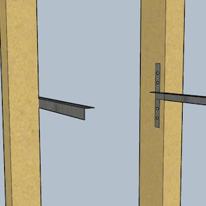 May include: Two metal shelf brackets attached to wooden posts. The brackets are made of metal and have a silver finish. The brackets are attached to the posts with screws.