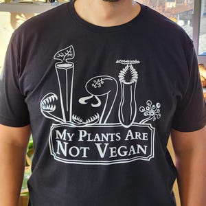 Köttätande växter är inte veganer - Svart unisex-t-shirt