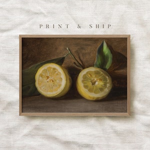 May include: A painting of two halved lemons with green leaves on a brown background. The lemons are yellow and have a light brown interior. The leaves are green and have a light brown stem. The background is a dark brown.