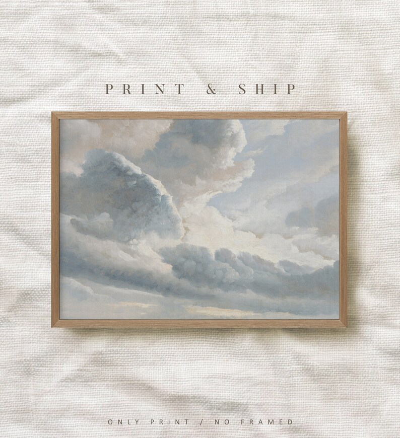 May include: A framed print of a painting depicting a cloudy sky with shades of blue and gray. The clouds are layered and textured, creating a sense of depth and movement. The print is framed in a light wood frame.