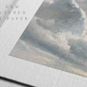 May include: Close-up of a textured white art paper with the text "280 GSM TEXTURED ART PAPER" printed on it. The paper has a subtle grain and a soft, matte finish.
