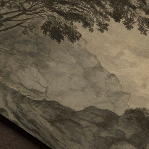 May include: A vintage, sepia-toned image of a landscape with a tree in the foreground and a mountain range in the background. The image has a faded, textured look.