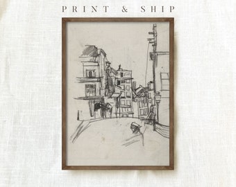 May include: Black and white pencil drawing of a street scene with buildings, a lamppost, and a telephone pole. The drawing is framed in a brown wood frame.
