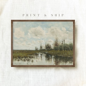 May include: A framed painting depicting a landscape with a river, trees, and a cloudy sky. The painting is in a brown frame and has a signature in the bottom left corner.