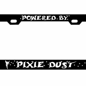 May include: Black metal license plate frame with white text that reads "Powered by Pixie Dust" with a fairy silhouette and stars.