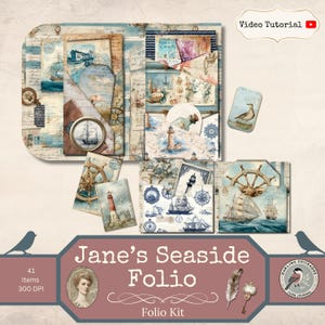 May include: A nautical-themed paper craft kit titled Jane's Seaside Folio, featuring 41 items with illustrations of lighthouses, sailing ships, compasses, and maritime maps in shades of blue, cream, and brown, including pockets and tags.