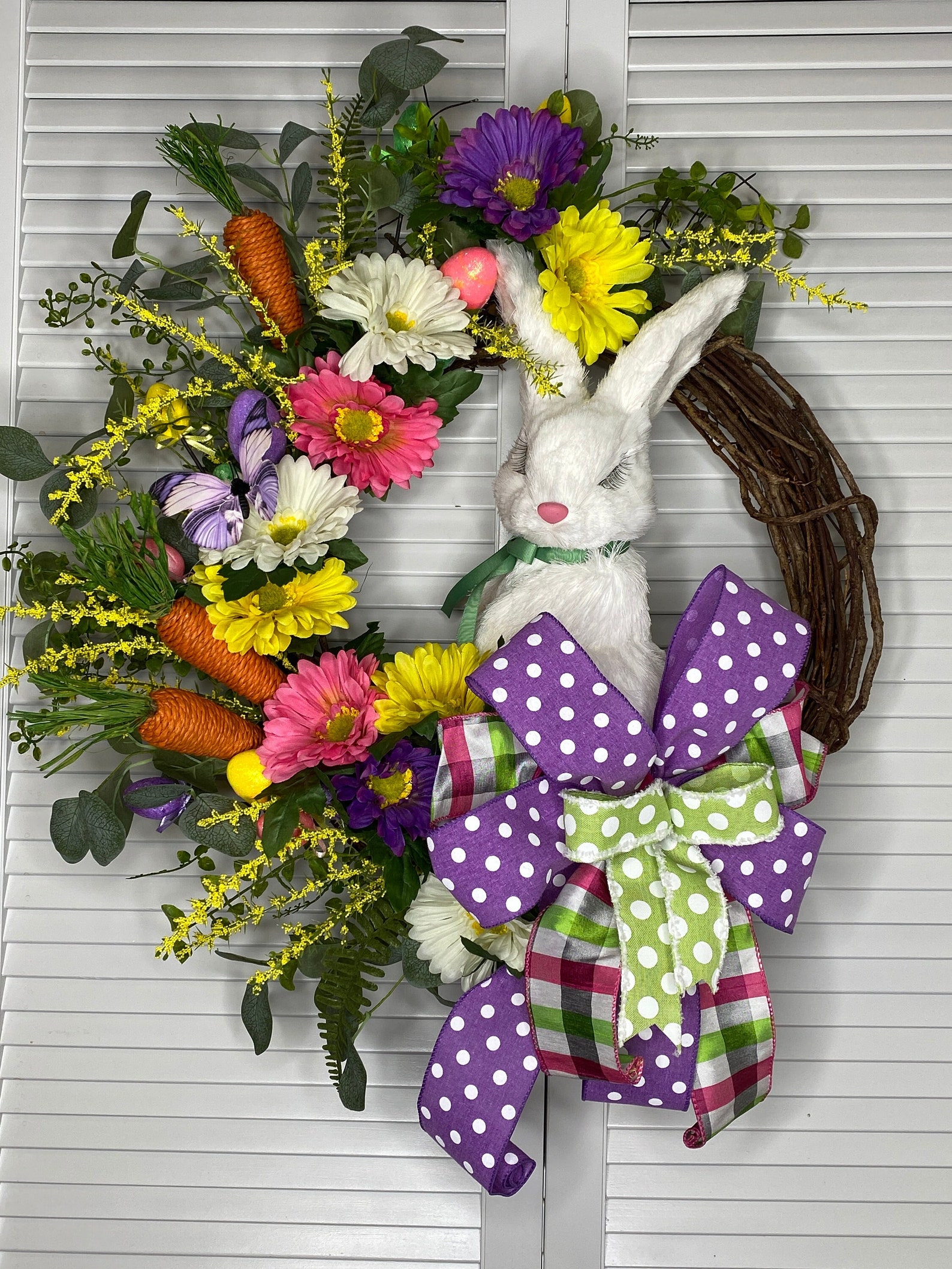 Partially Covered Grapevine Wreaths with Flowers, Greenery, Eggs and Carrots
