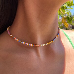 orange white purple pink and gold seed beed necklace