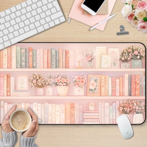 May include: A pink and white bookshelf with books and flowers. The bookshelf is on a wooden surface with a keyboard, a notebook, and a mouse.