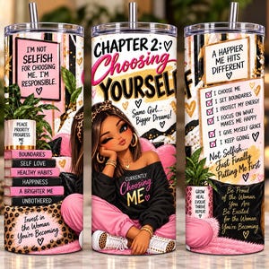 May include: A cylindrical tumbler with a metal straw featuring a graphic of a person in a black sweatshirt and pink pants, surrounded by text including "Chapter 2: Choosing Yourself," "I'm Not Selfish," and "A Happier Me Hits Different."