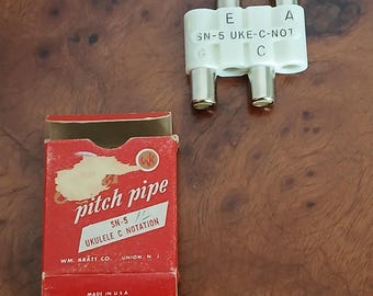 Ukelele antiguo con diapasón en Do
