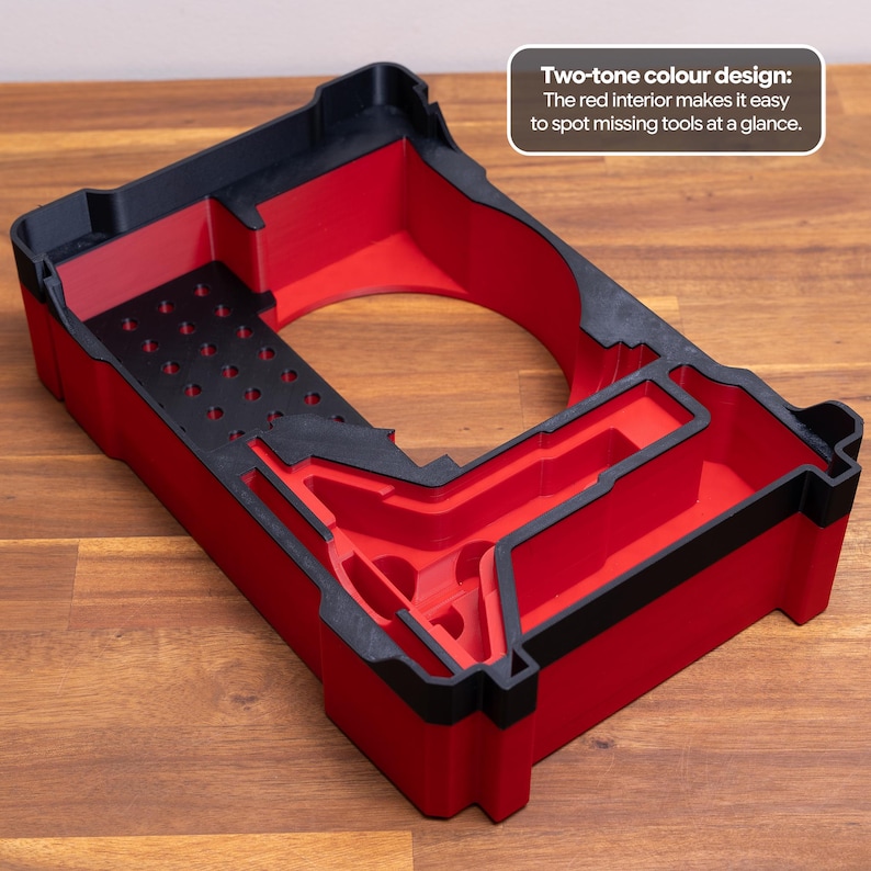 May include: A rectangular tool organizer tray featuring a two-tone black and red design. The interior is red with a black base section containing multiple circular holes. Text on the tray reads: Two-tone colour design: The red interior makes it easy to spot missing tools at a glance.