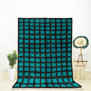 A sheepskin Beni Ourain Moroccan Blue and Black checkered rug
